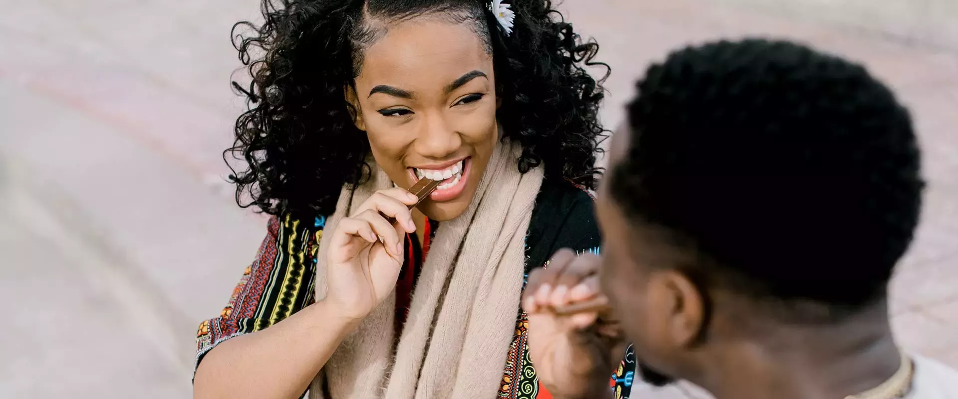 young people sharing a KitKat