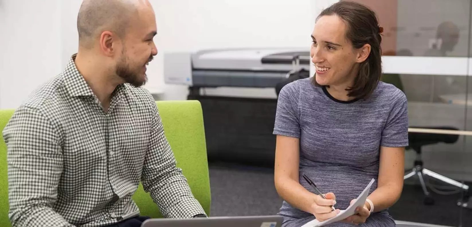 Colleagues discussing in office