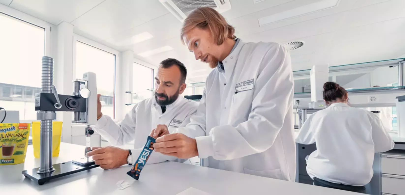 lab workers stress testing packaging
