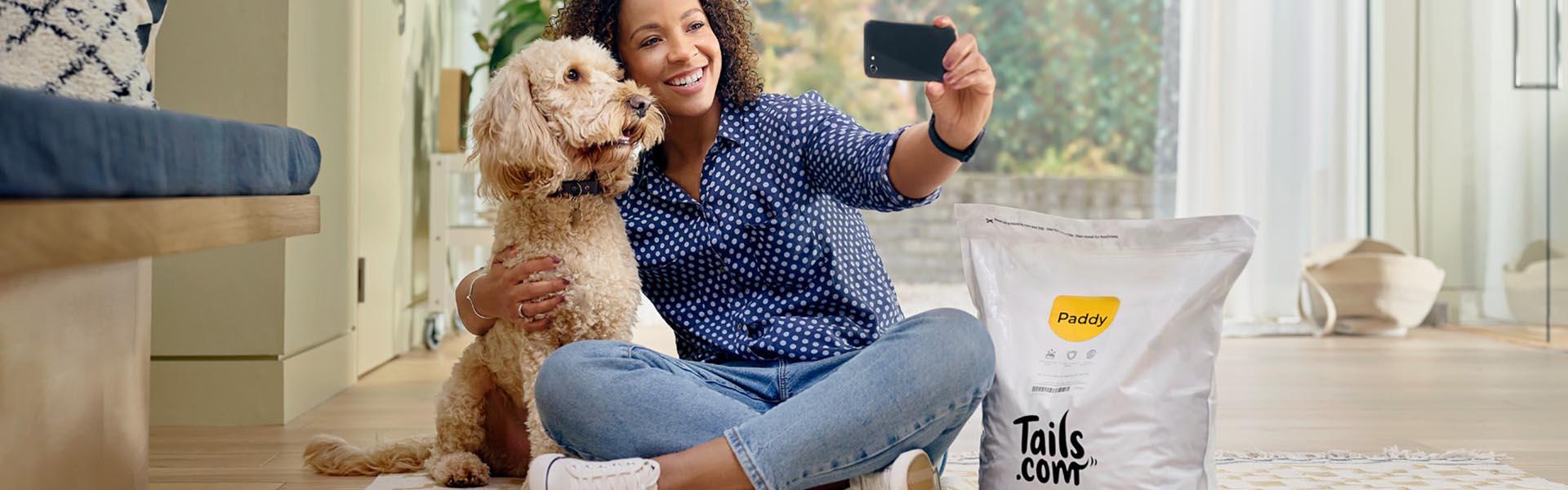 Woman doing selfie with her dog