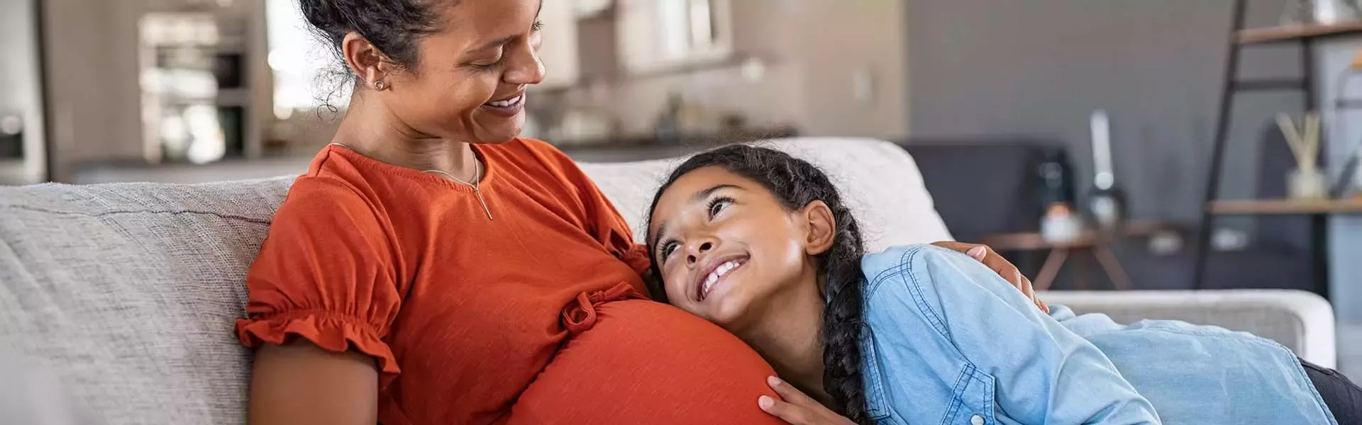 Pregnant woman with her daughter