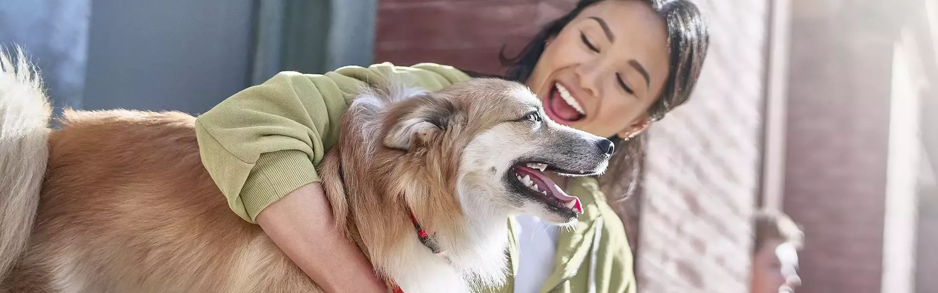 Woman hugging her dog