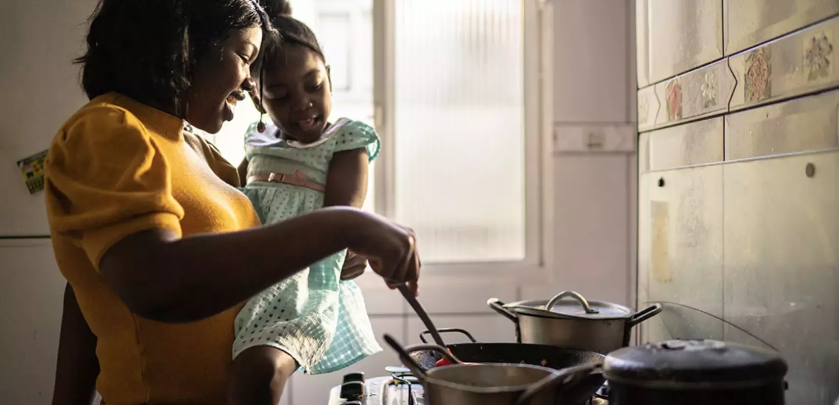 Mother and daughter cooking
