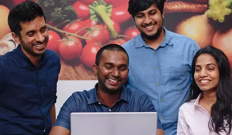 apprentice with colleagues