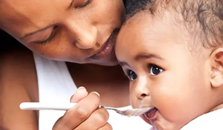 mother feeding baby