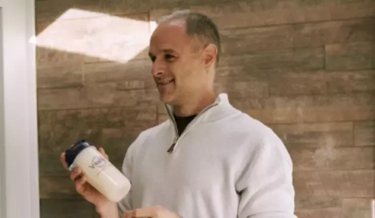 Man with a Vitaflo bottle