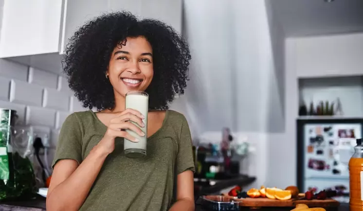 Woman drinking a glass of Vital