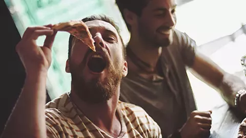 friends enjoying pizza lunch