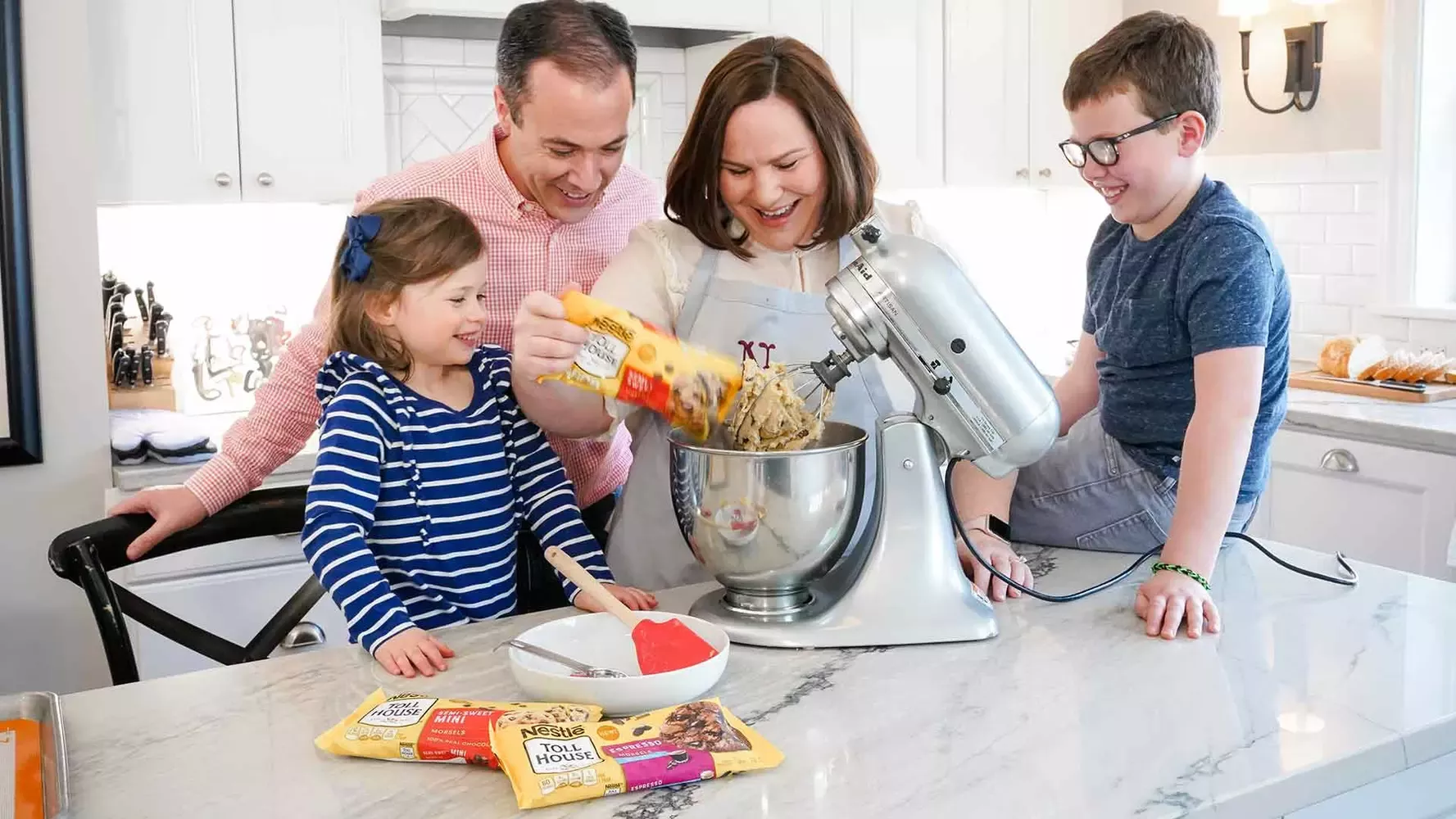 Family making chocolate chip cookies