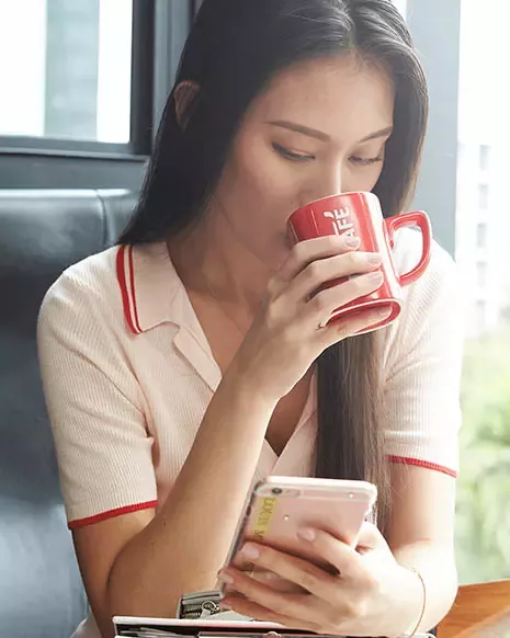 Woman drinks Nescafe
