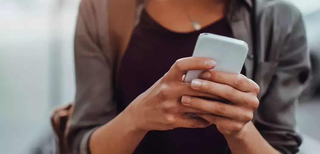 person checking message on smartphone