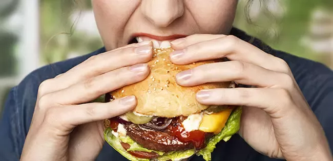 woman eating a burger