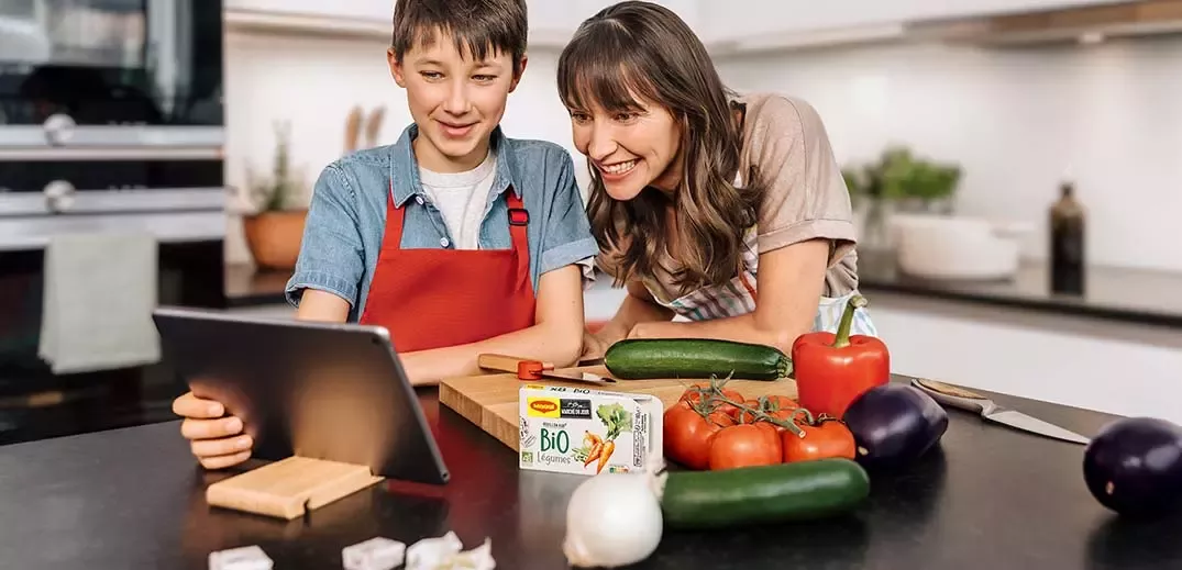 mother and child cooking together