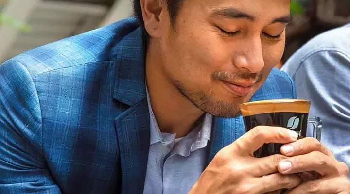 Man drinks coffee