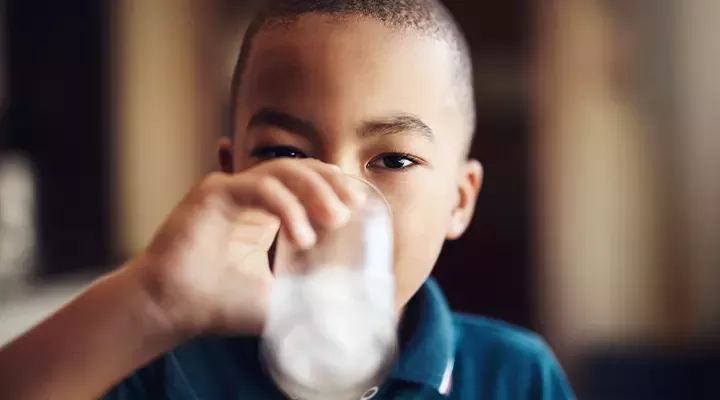 Child drinking glass of water