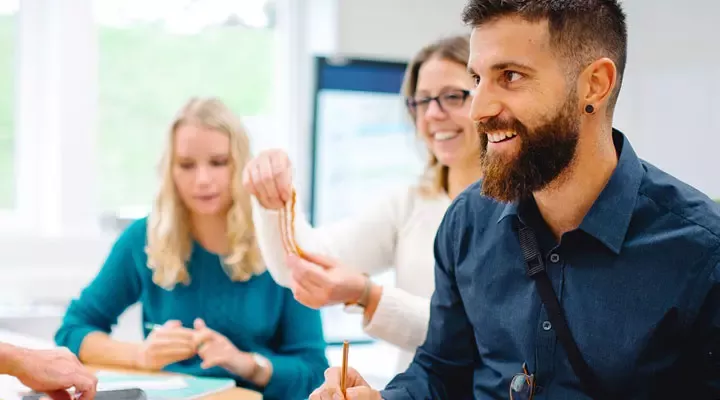 A man and two women working together at the Nestlé company