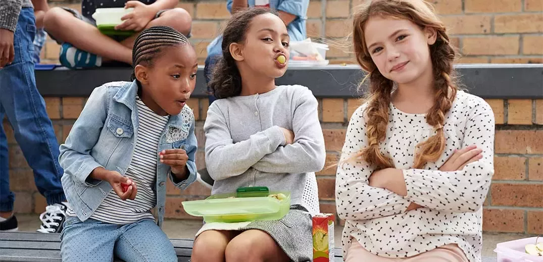 Children having healthy lunch at school