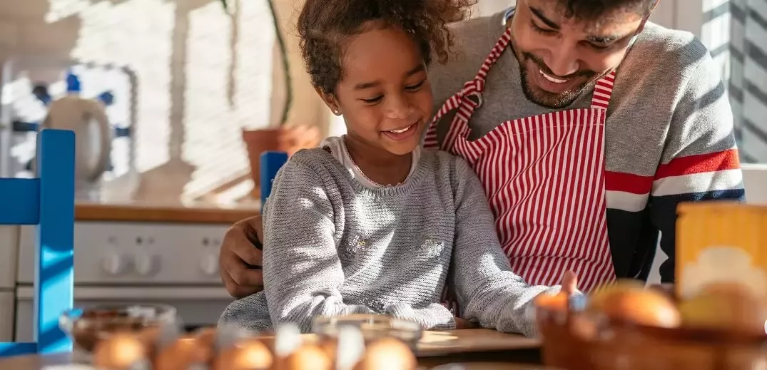 father and daughter cooking
