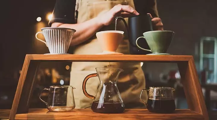 Barista makes coffee