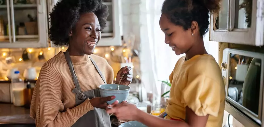 Mother and daughter having breakfast