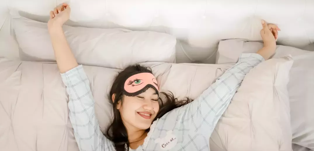 Girl stretching in bed