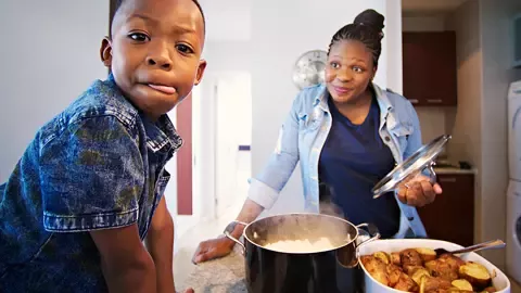 child and parent cooking together