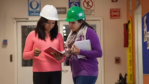 Workers reviewing risk assessments