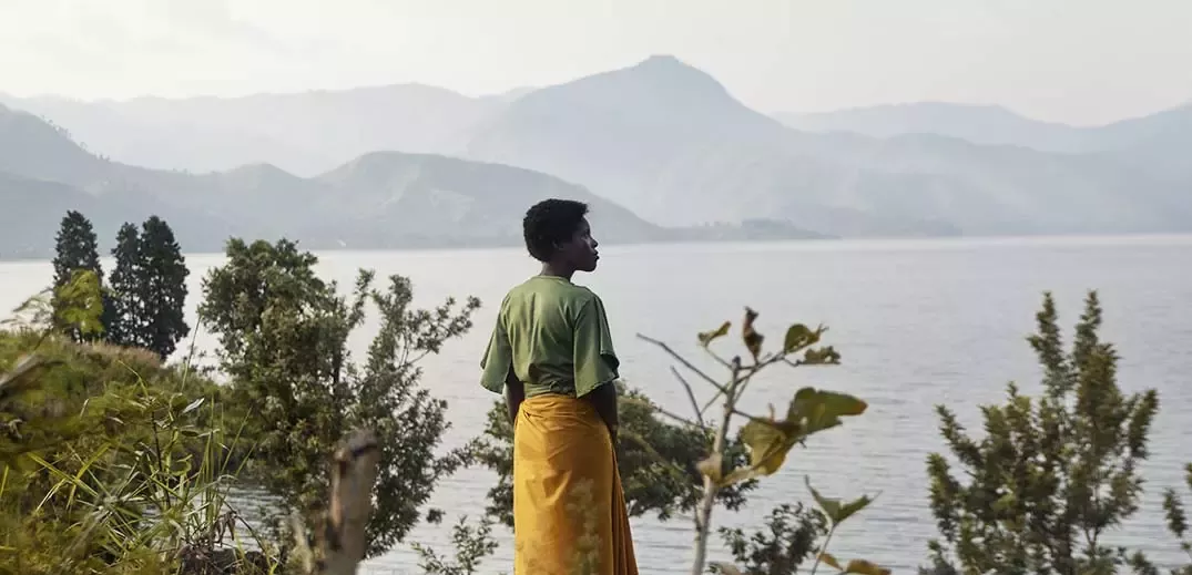 Woman stands near sea