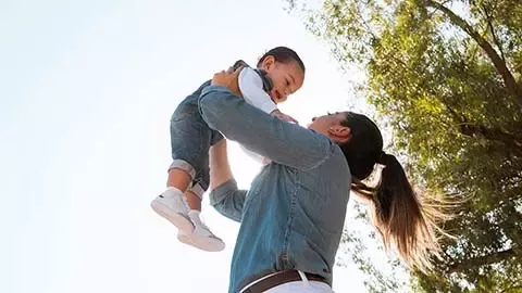 Mom holding a child