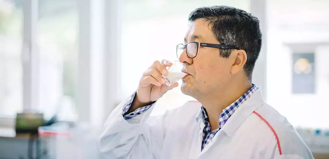 Scientist checking milk sample