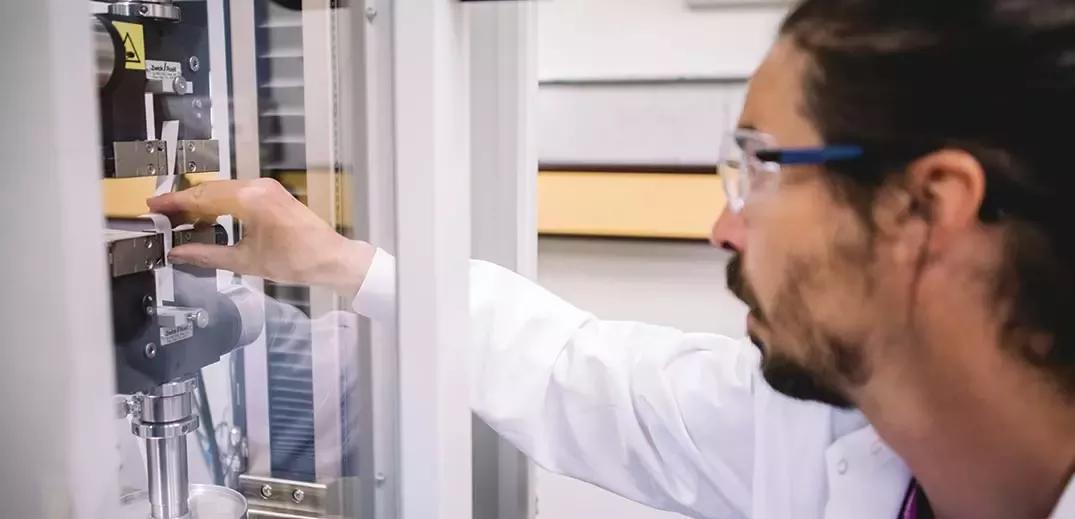 scientist checking machine