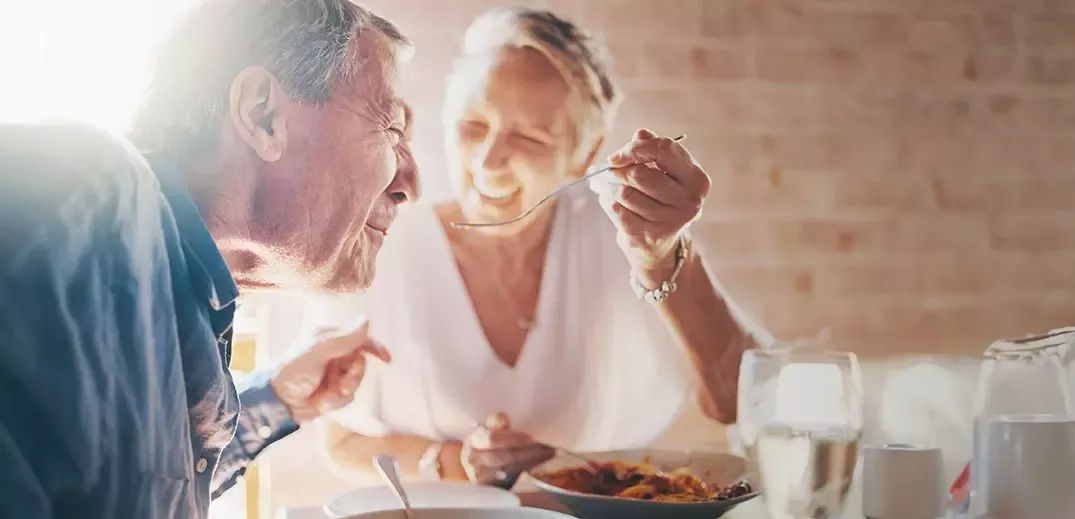 Elder couple having breakfast