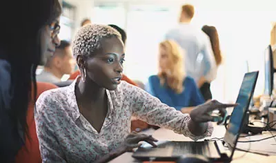 Two women working