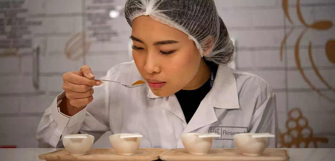 Female scientist at the Research & Development center is checking a new product