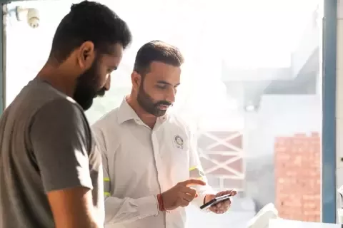 two men checking on the phone