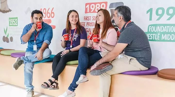 People are drinking coffee at work