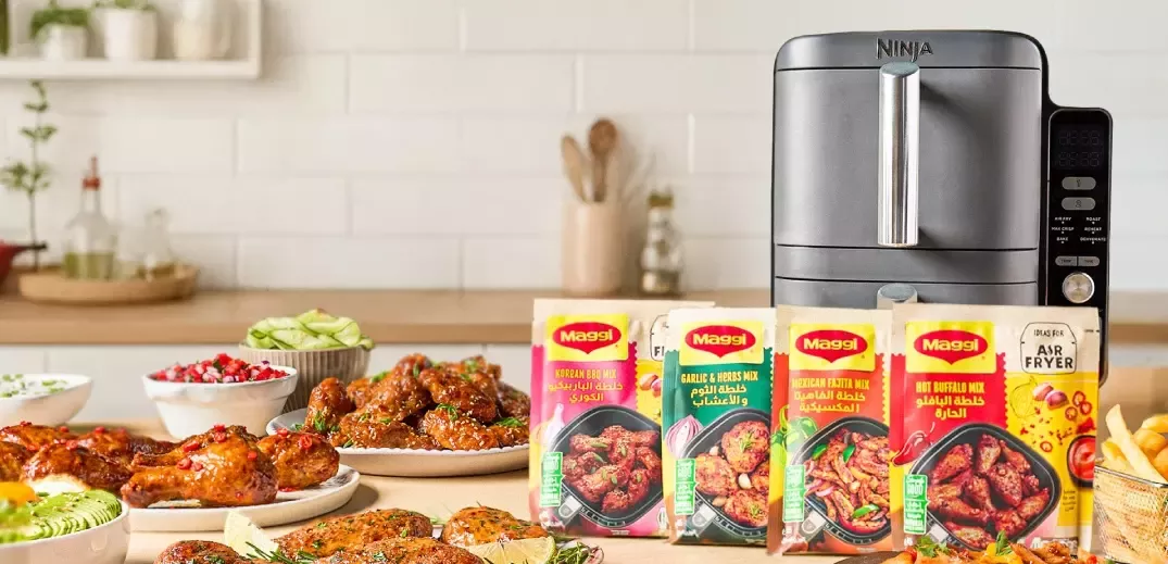 An Airfryer with food and Maggi packages on the table