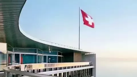 Swiss flag on modern building.