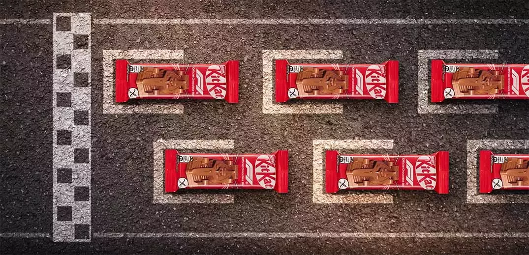 KitKat Formula 1 chocolate bars arranged on a racetrack grid marking starting positions