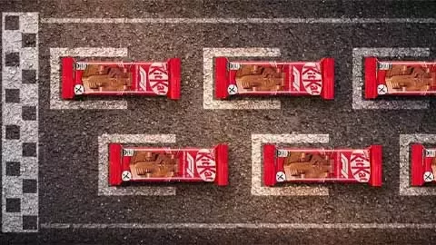 KitKat Formula 1 chocolate bars arranged on a racetrack grid marking starting positions