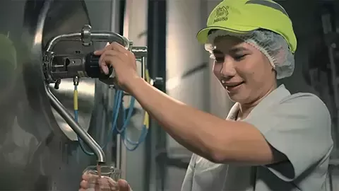 worker turns the tap