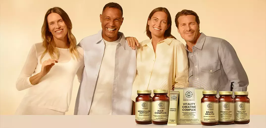 Group posing behind Solgar Prime nutritional supplements, including creatine and multivitamins