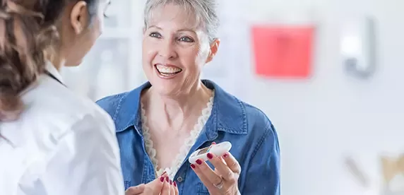 senior woman checks blood sugar level