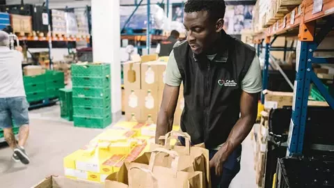 Man filling bag