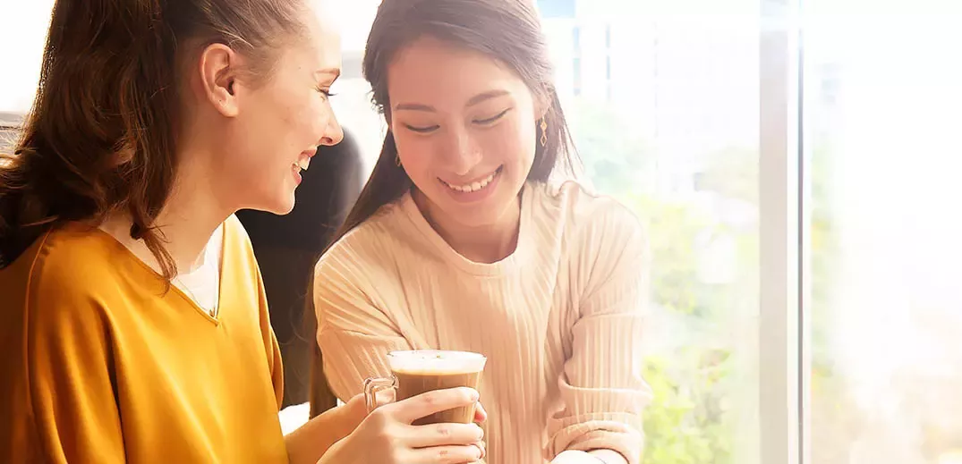Young women having coffee