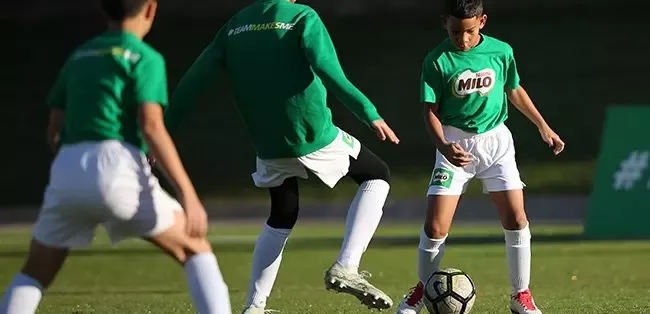 Boys playing football