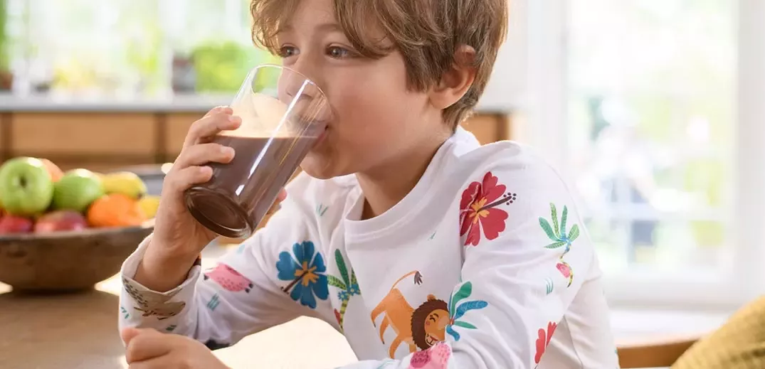 boy drinking Nesquik