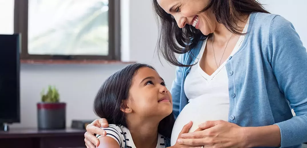 pregnant mother with daughter