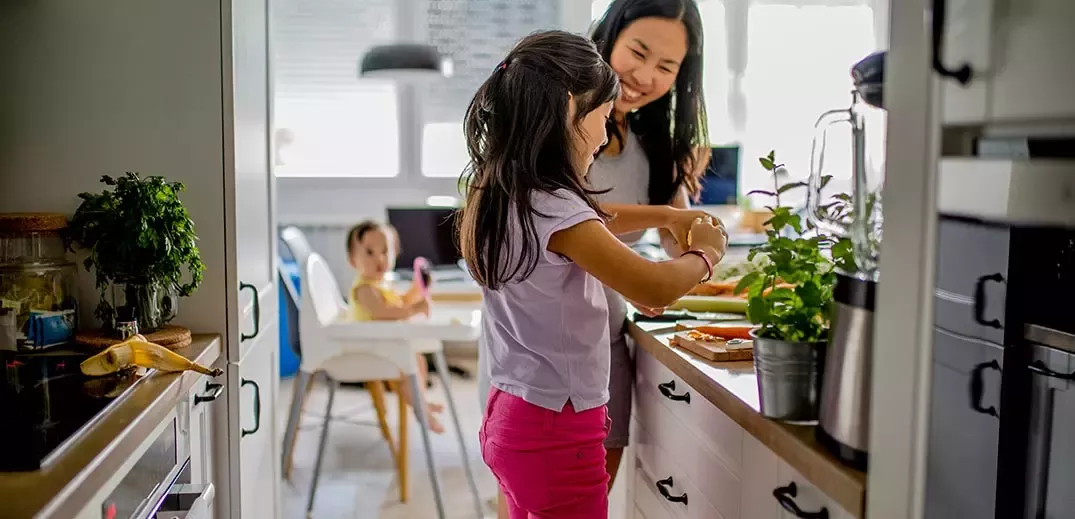 Mom cooking with daughter