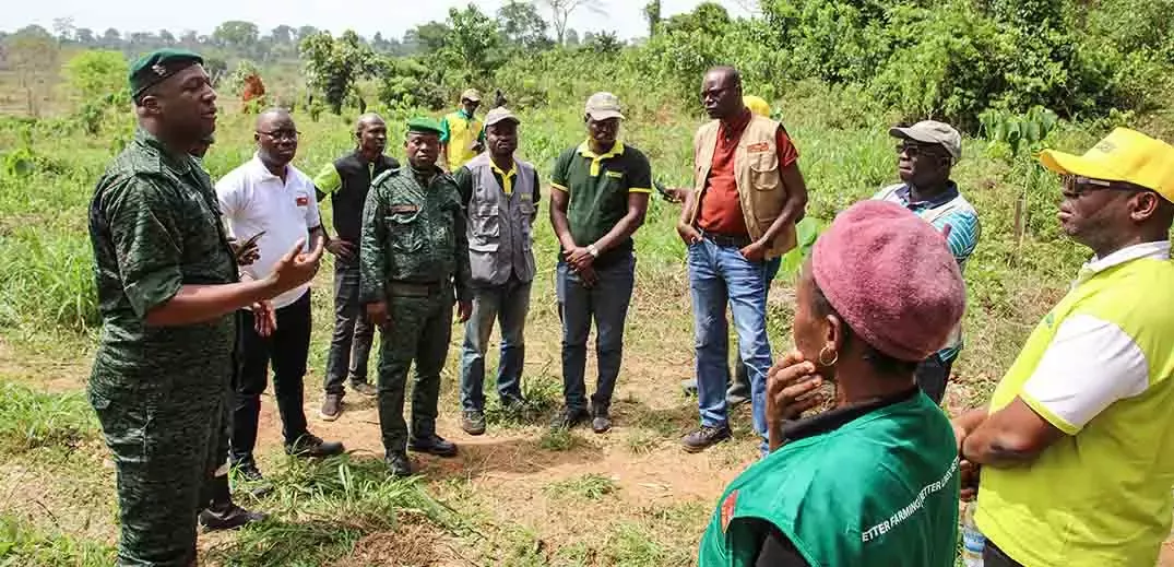 MINEF members helping to replant a deforested plot